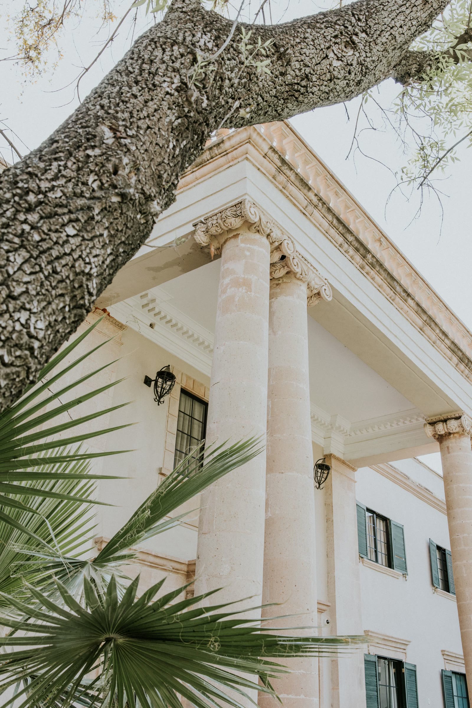 Classical stone columns framing a villa entrance, Stonosphere heritage craftsmanship
